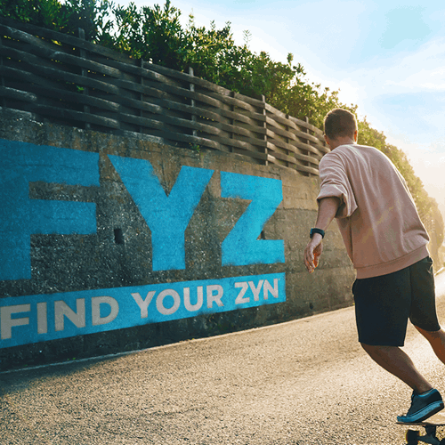 ZYN logo backwards with a young man roller skating. 
