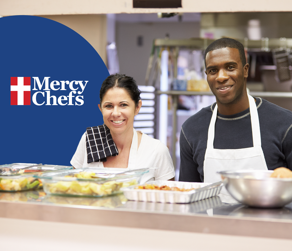Man and Woman in Aprons Serving Food