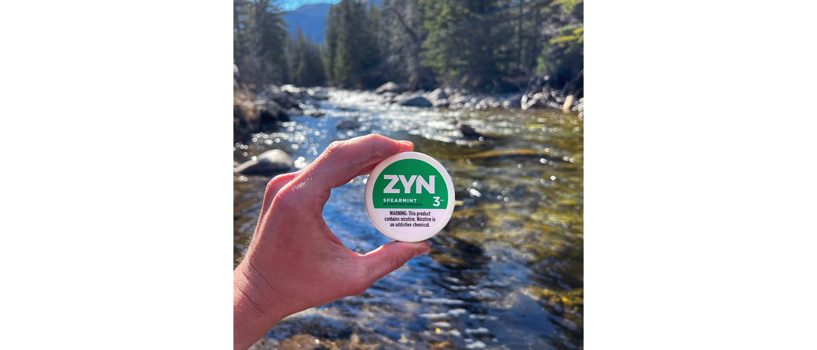 ZYN Across America winner submission of a spearmint 3 ZYN can with a lake background.