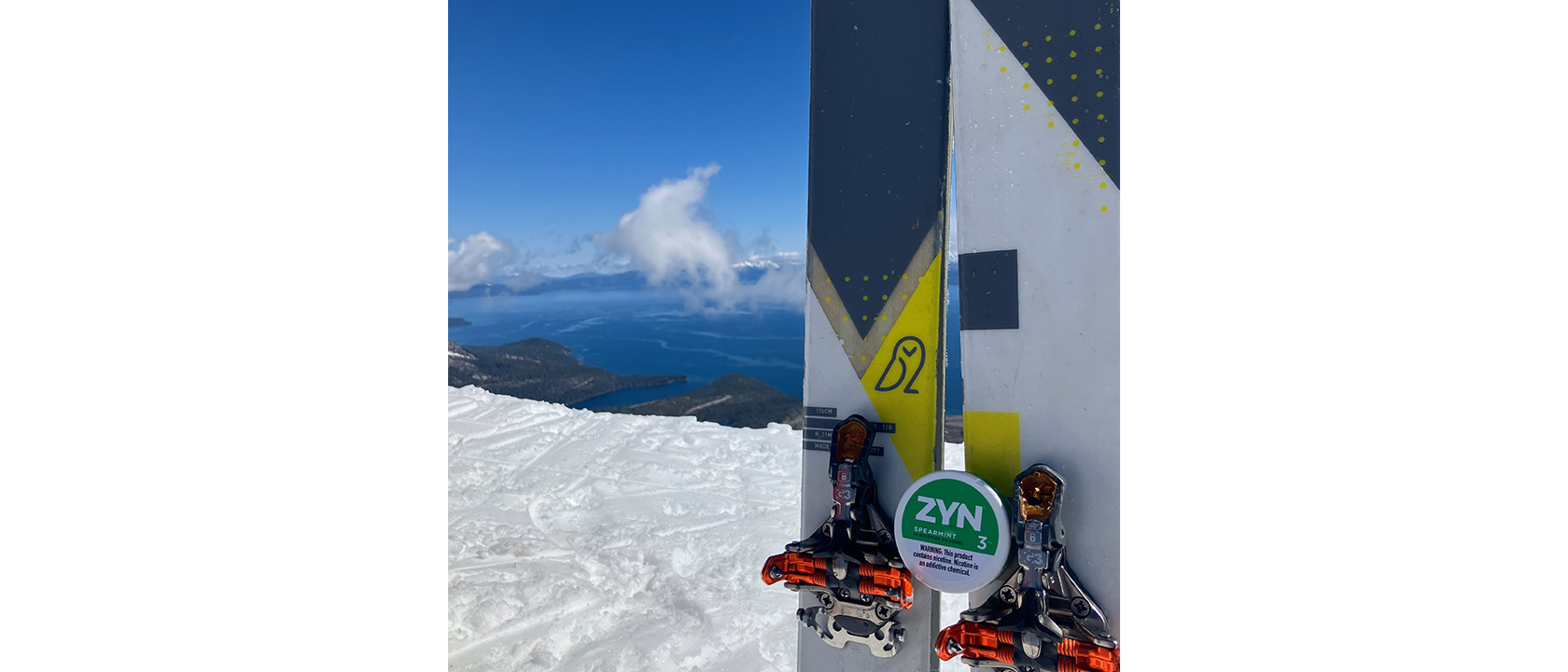 ZYN Across America winning submission of a spearmint 3 ZYN can nestled on a set of skis' on the top of a mountain.